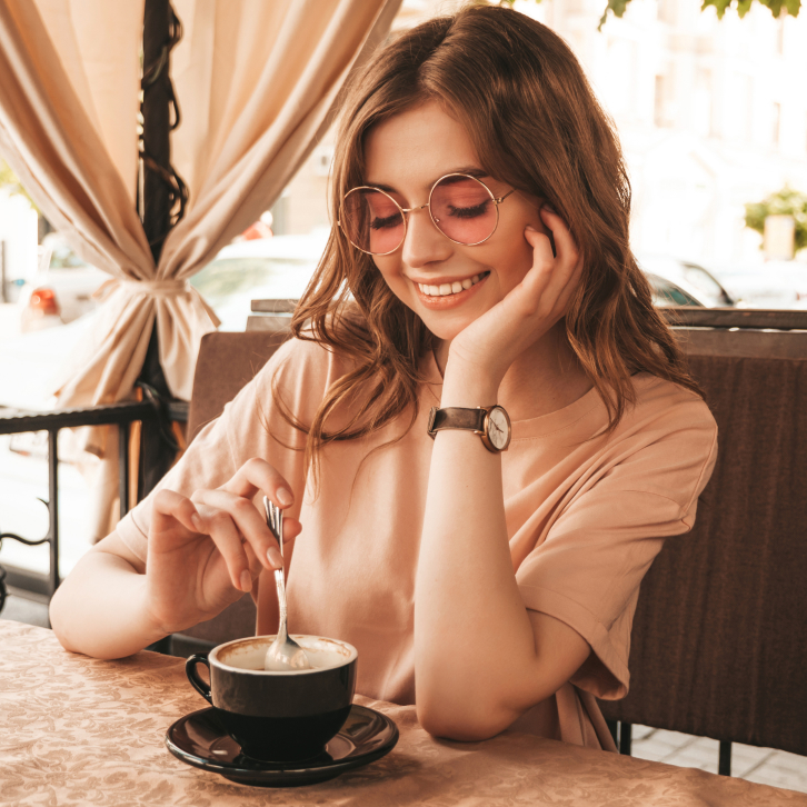 a girl with a cup of coffee